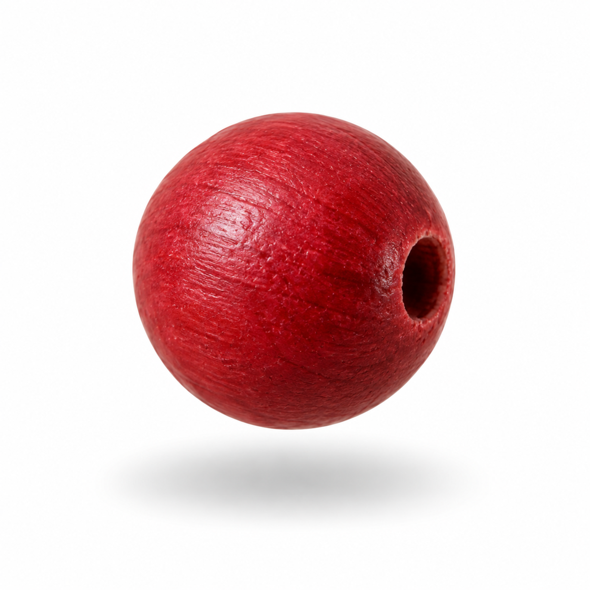 A single round wooden bead in a vibrant red color, floating against a solid white background with a soft drop shadow underneath.
