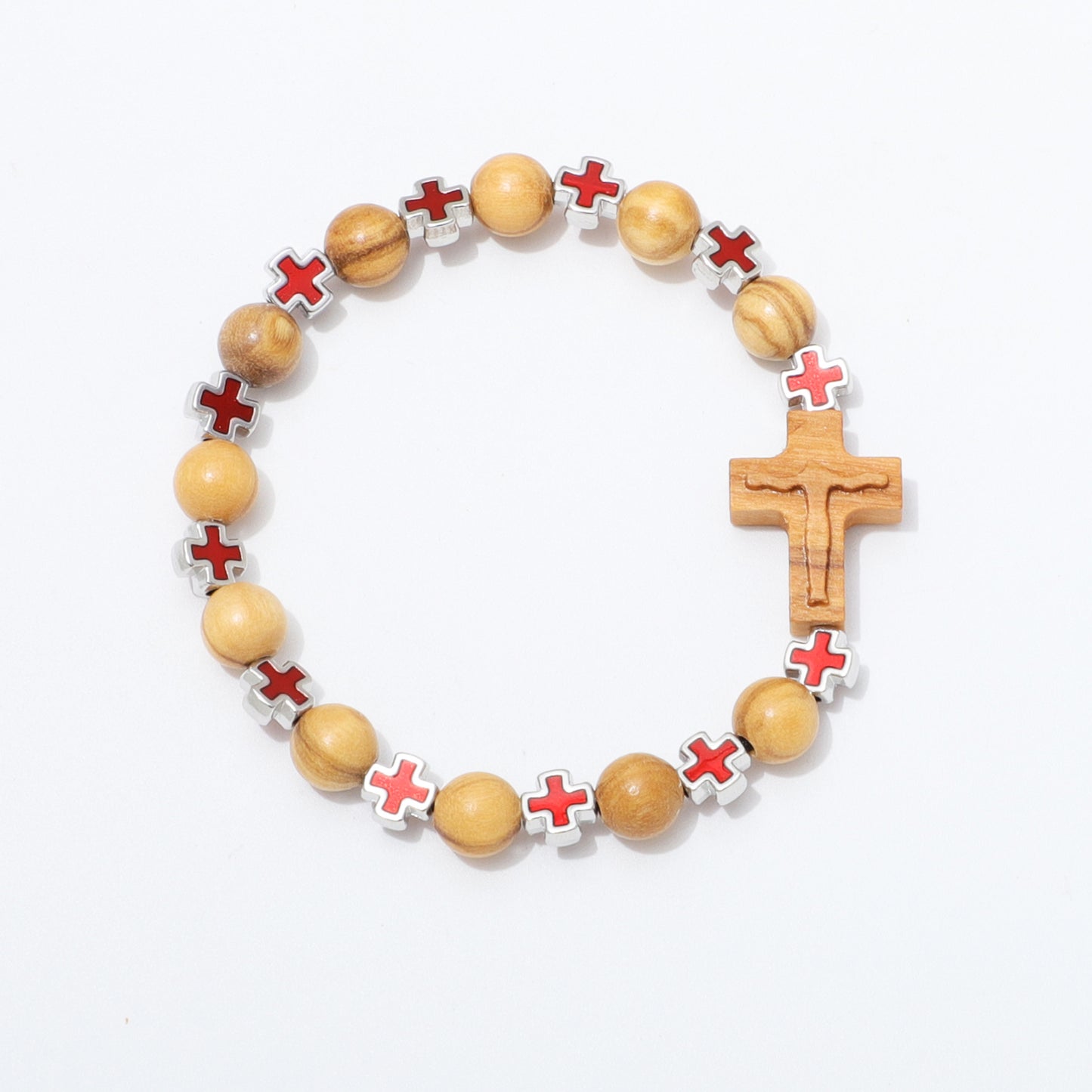 A beaded bracelet featuring light brown wooden beads, silver-toned cross-shaped beads with red cross inlays, and a wooden crucifix, displayed on a clean white background.