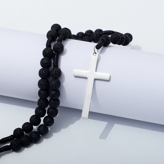 Rosary with Lava Beads and Polished Silver Cross Draped Over Display Cylinder