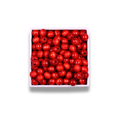 Box of red beads on a white background