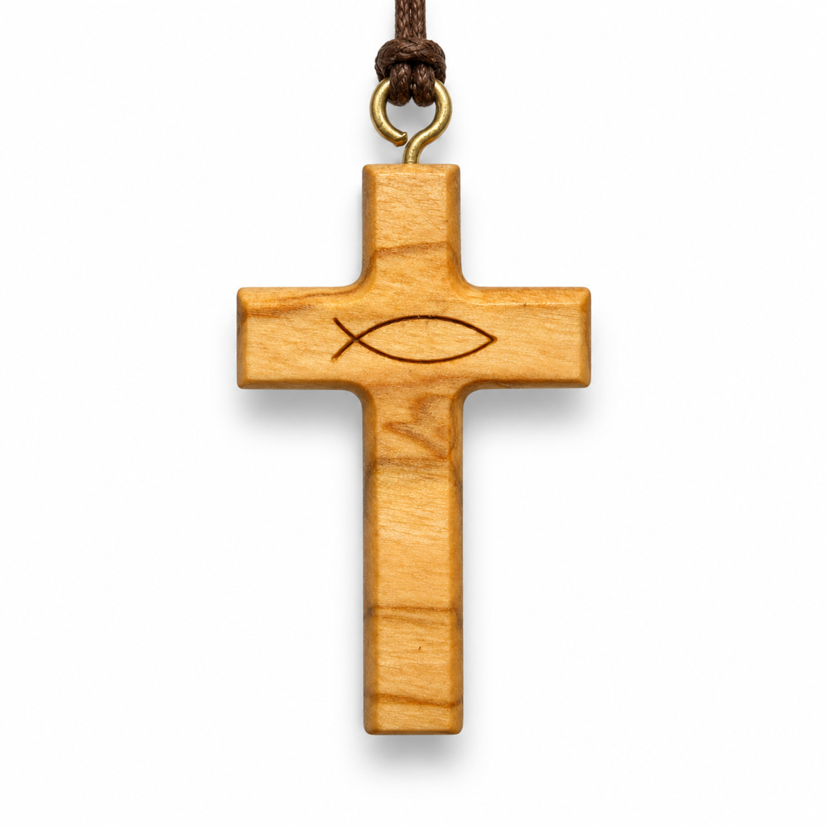 A light-colored olive wood cross pendant featuring an engraved Christian fish symbol at the center, suspended from a dark brown cord with a brass ring, shown against a plain white background.