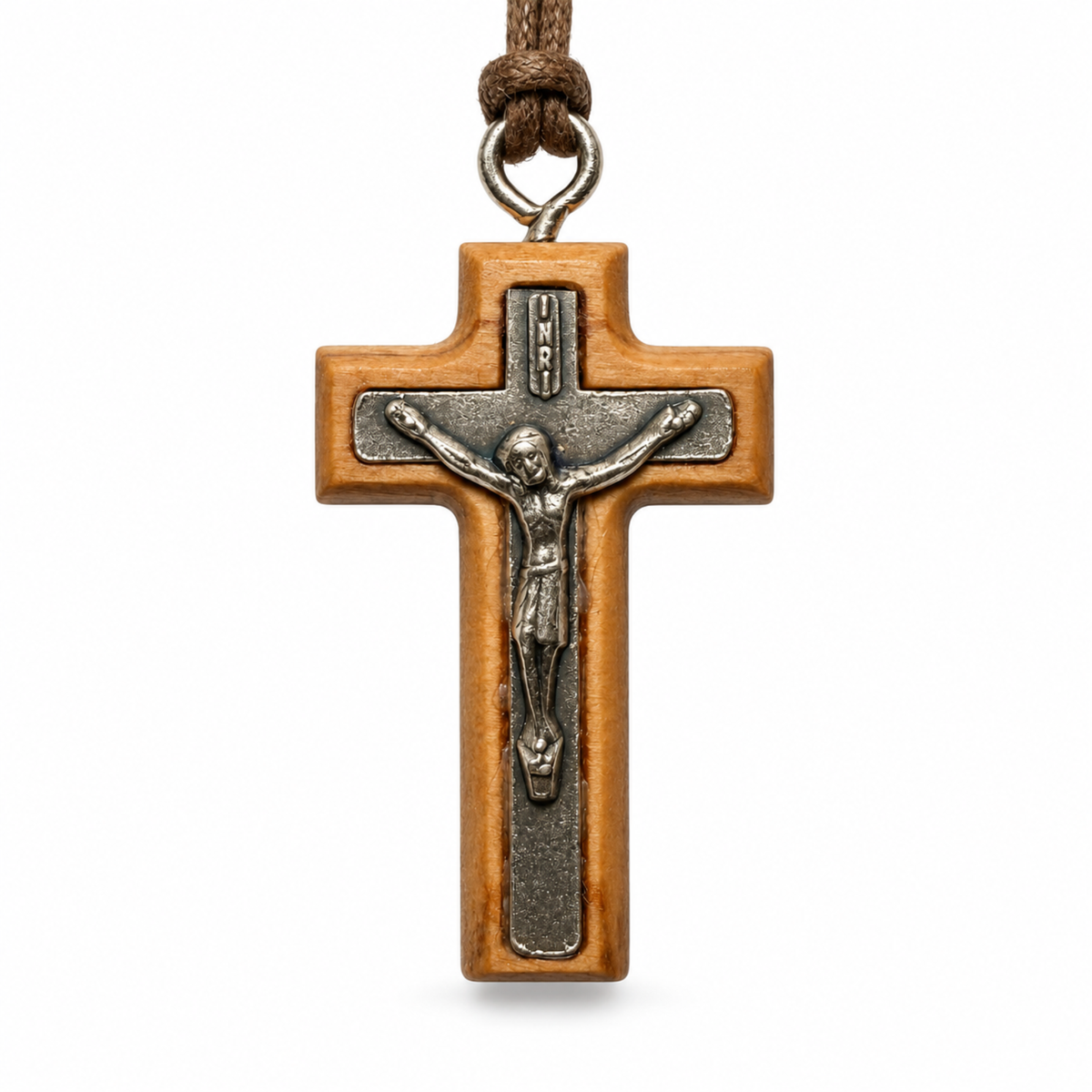 A wooden crucifix pendant with a silver-toned metal corpus and a brown cord loop at the top, shown against a plain white background.