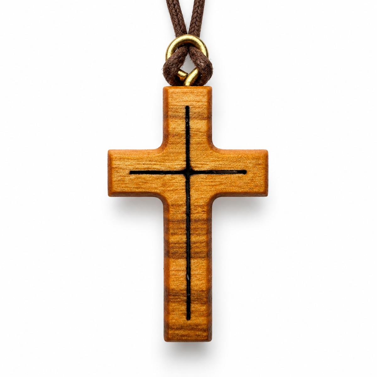 A wooden cross pendant with a black engraved cross design, hanging from a brown cord with a gold metal ring, shown on a plain white background.