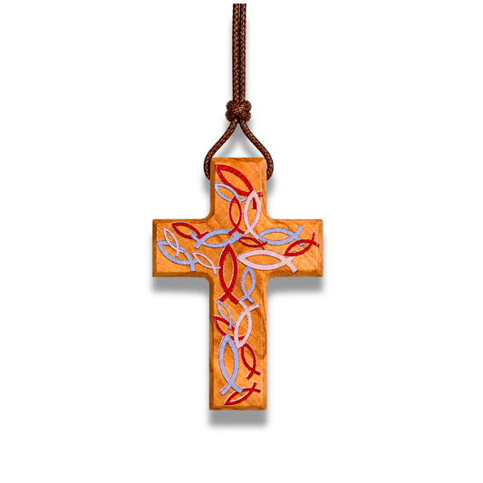 Handcrafted olive wood cross necklace featuring red Ichthus fish engravings forming a woven pattern on the surface, suspended on a brown cord.
