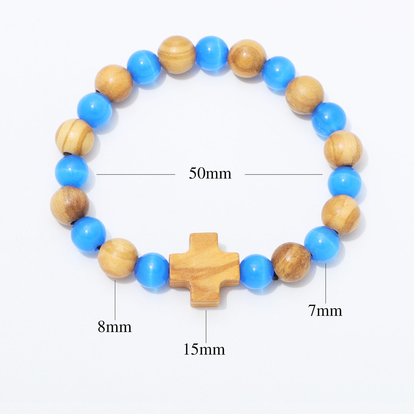 A beaded bracelet with blue and natural wood beads, featuring a central wooden cross charm. White measurement lines and text labels indicate dimensions: 50mm for the full bracelet, 15mm for the cross, 8mm for one bead, 7mm for another bead, and 10mm for the remaining beads.