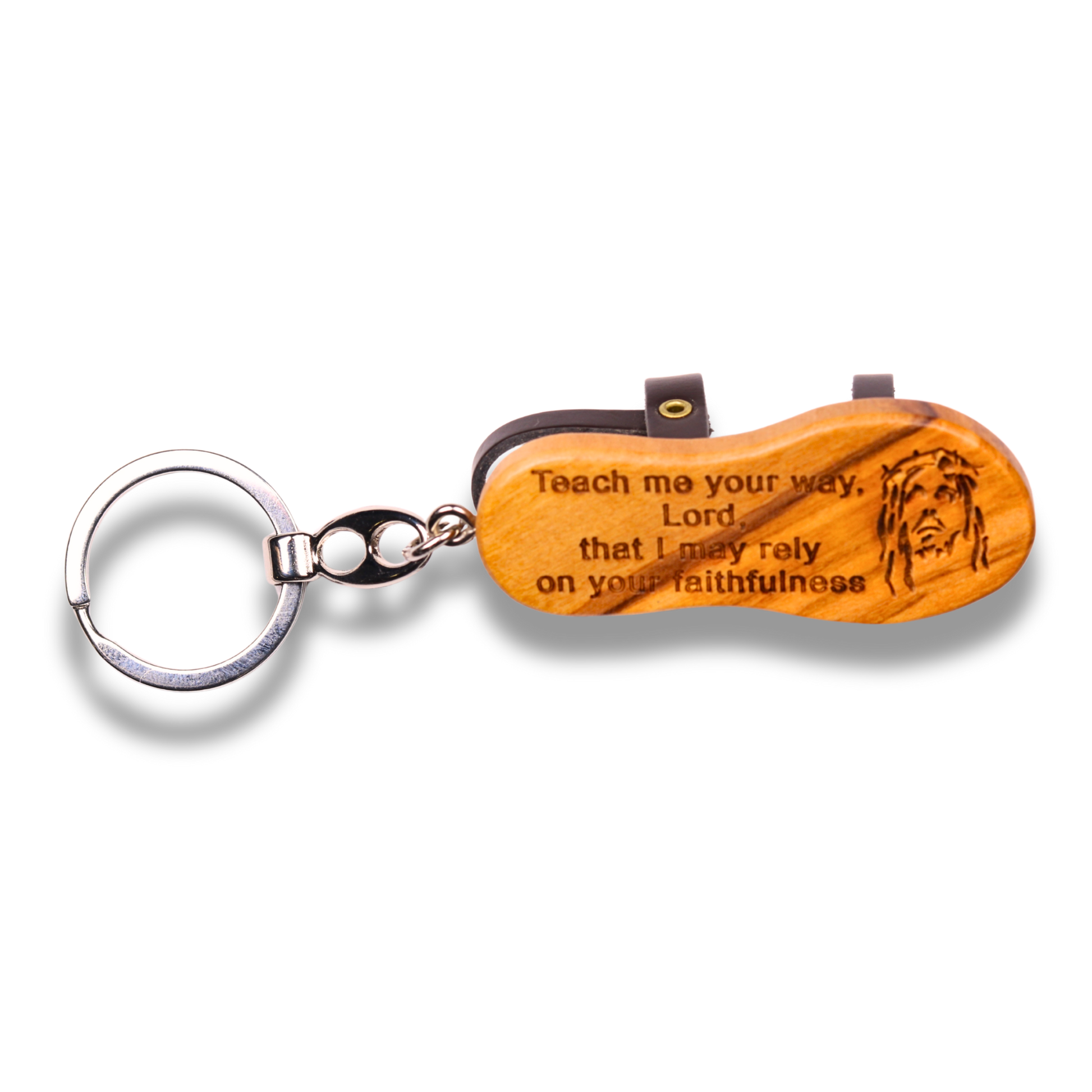 Wooden keychain with engraved text and a metal ring on a white background