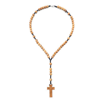 Wooden rosary necklace with a cross pendant on a white background