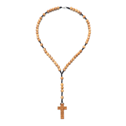 Wooden rosary necklace with a cross pendant on a white background