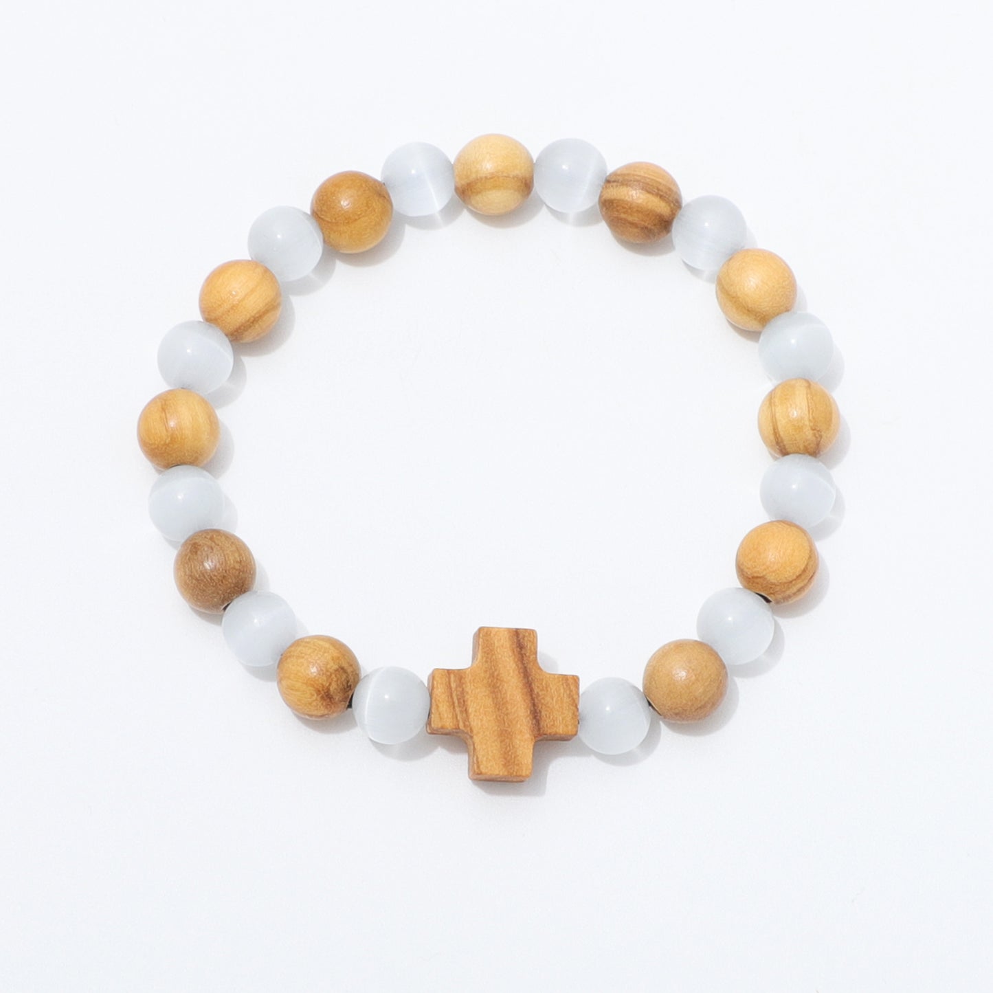 A beaded stretch bracelet featuring alternating light brown wooden beads, translucent white beads, and a central wooden cross charm, displayed on a clean white background.