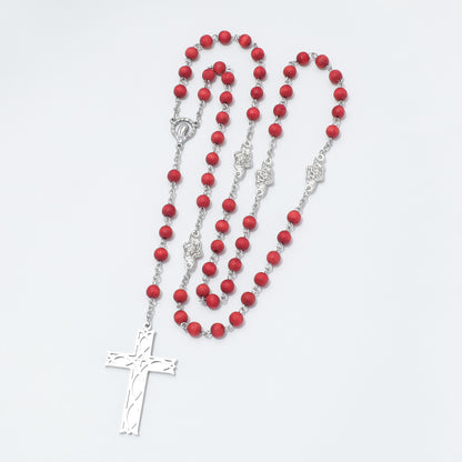 Close-up of Ichthus fish cross on Maria rose scented rosary