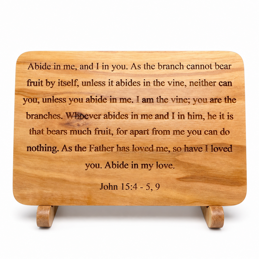 Front view of olive wood scripture plaque engraved with John 15:4–5, 9 on a wooden stand