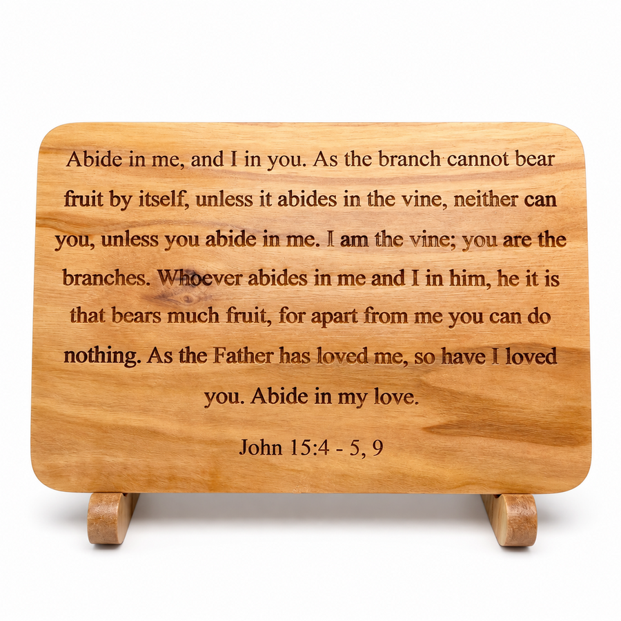 Front view of olive wood scripture plaque engraved with John 15:4–5, 9 on a wooden stand