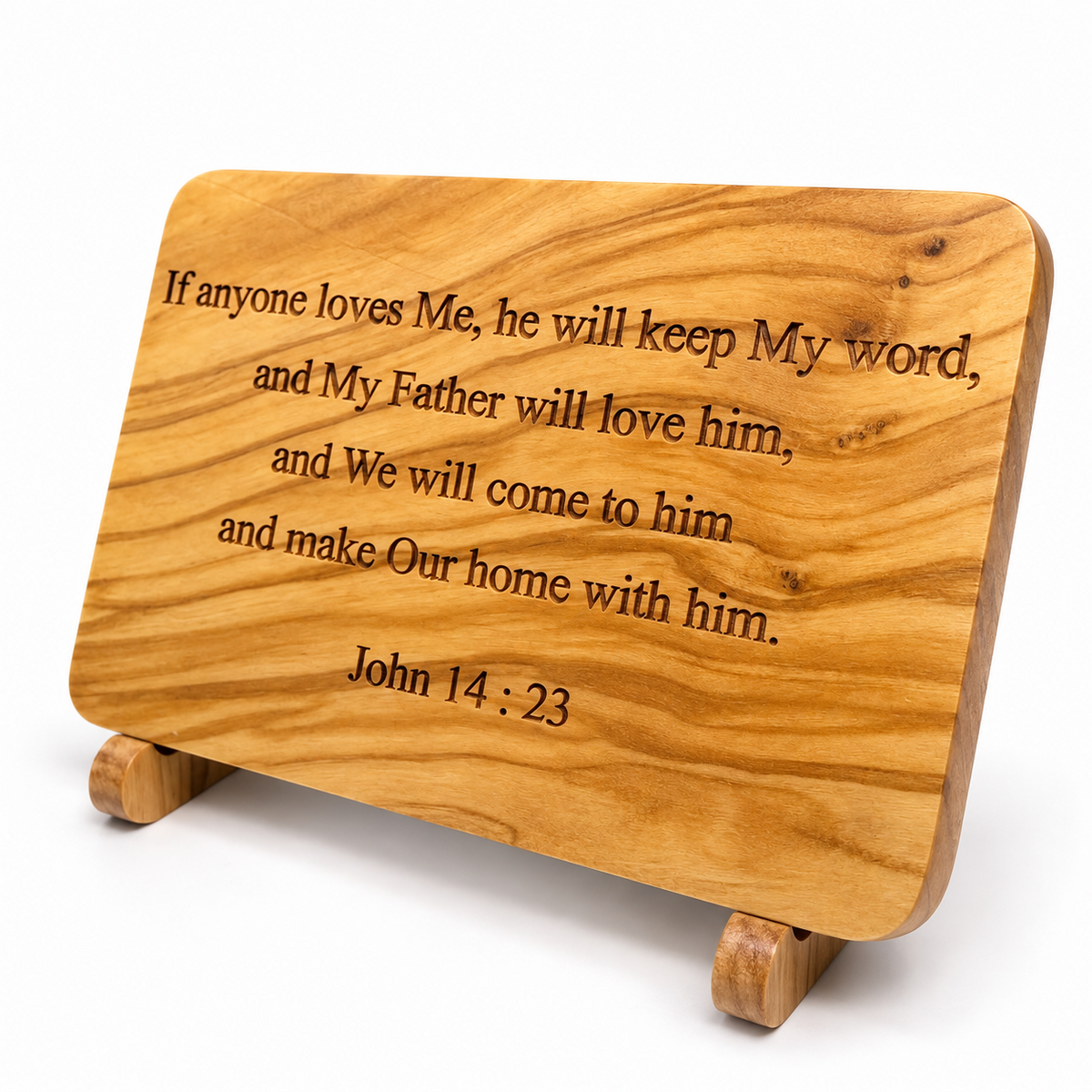 Angled view of the John 14:23 olive wood plaque showing the engraved Bible verse, natural grain and wooden stand.