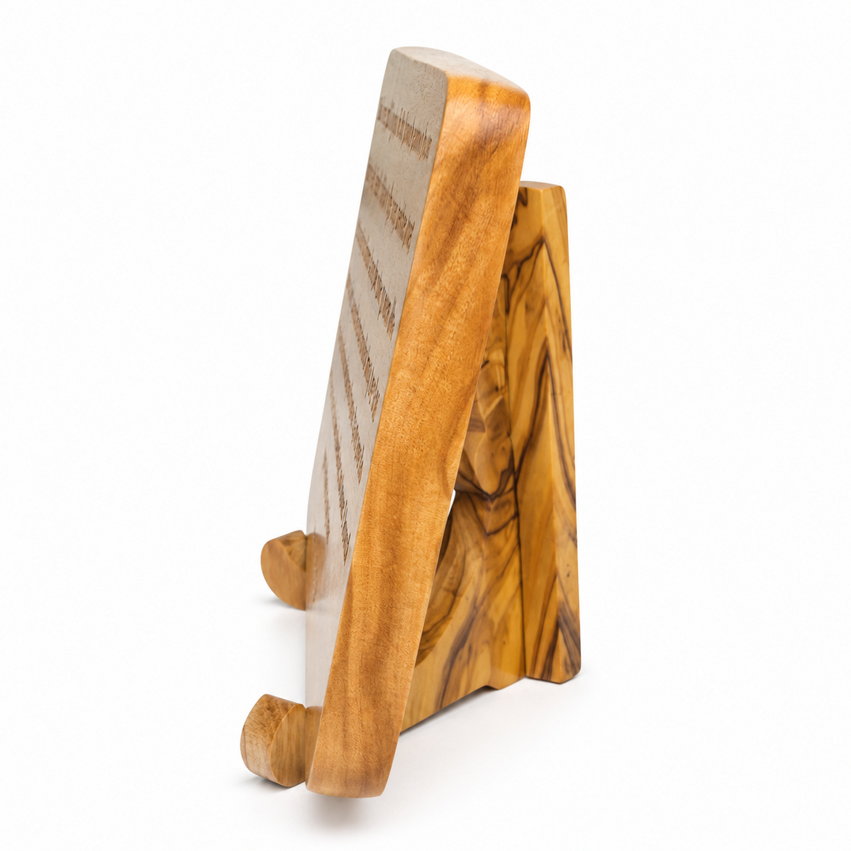 Side profile of the olive wood scripture plaque showing its rounded edge, thickness and wooden display stand.