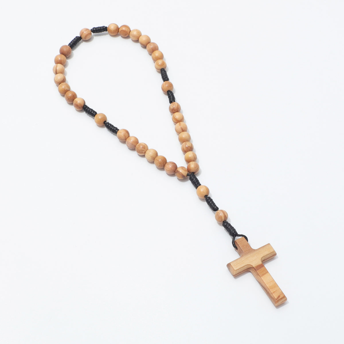 Olive wood 6mm prayer beads arranged in a long loop with cross, viewed at an angle