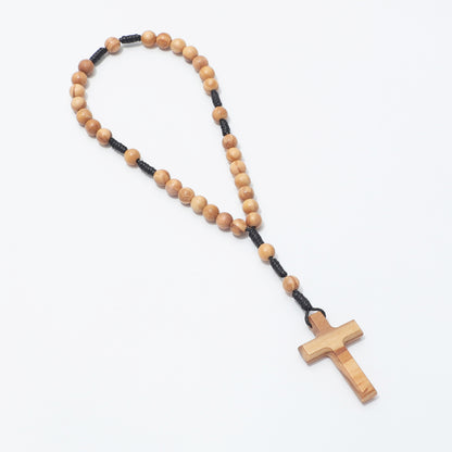 Olive wood 6mm prayer beads arranged in a long loop with cross, viewed at an angle