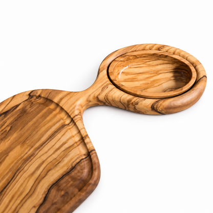 Close-up of the removable oval plate seated in the olive wood serving tray