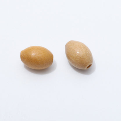 Two olive wood oval beads on a white background